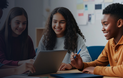 three kids surrounding a laptop smiling